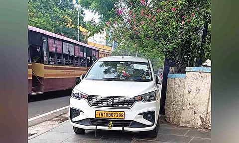 A vehicle contracted by the union government parked on the pavement in front of the railway office near Egmore Metro Station entrance