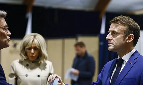 France President Emmanuel Macron casts his vote (AP)