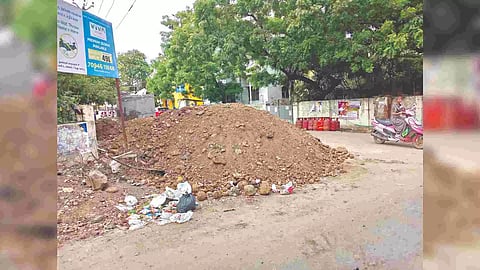 Debris from the sewage works dumped on Devadas Streel in Pammal