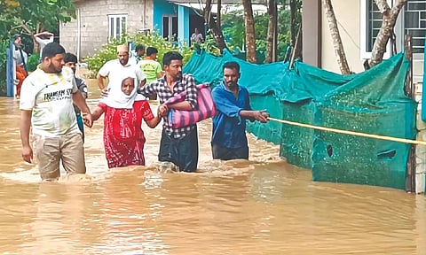 People being rescued from a flooded residential neighbourhood in The Nilgiris