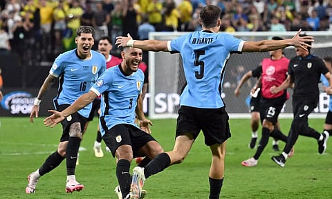  Uruguay players celebrate after winning their match against Brazil