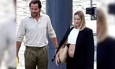 Tom Ackerley and Margot Robbie (IANS)