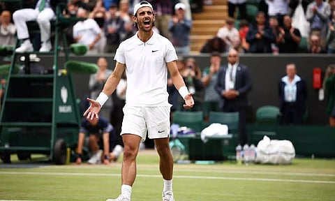  Lorenzo Musetti exults after his victory