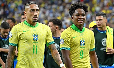 Brazil's Raphinha and Endrick leave the pitch after their team’s loss to Uruguay 