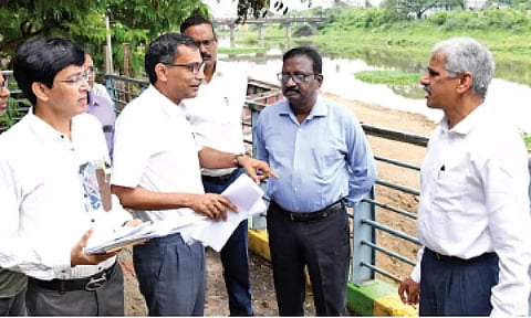 GCC officials and CS Shiv Das Meena inspecting desilting works in Adyar river on Saturday