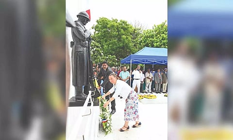 French Deputy Consul General Lise Dalbot Parre and Collector A Kulothungan pay floral tributes at the war veteran’s memorial in Puducherry on Sunday