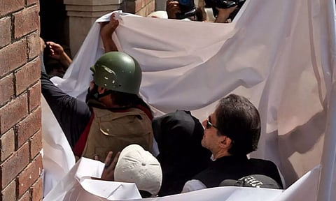 Pakistan former PM Imran Khan and his wife Bushra Bibi (Photo/Reuters)
