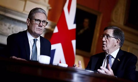 Britain's Prime Minister Keir Starme, George Robertson (AP)