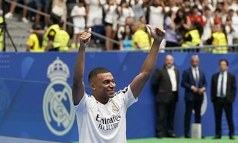 Kylian Mbappé gestures to the fans at the Santiago Bernabeu Stadium (Photo: AP)