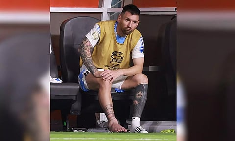 Lionel Messi watches the final of the Copa America from the sidelines with a swollen ankle