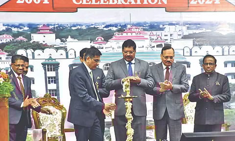 CJI Chandrachud lights a lamp. (right) Vigentennial Stupa unveiled at Madurai Bench premises