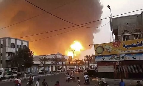 Smoke and flames rise from a site in Hodeidah, Yemen (AP)