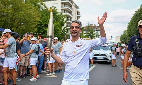 Abhinav Bindra carries the Olympic flame during the Torch Relay on Thursday