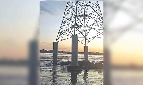 Tilted high-tension power tower in Kollidam