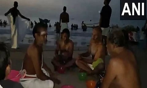 Devotees take holy dip at Thoothukudi harbour beach on 'Aadi Amavasai'
