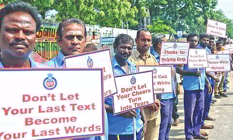 Bus drivers and traffic police personnel hold placards as part of the ‘Zero is Good’ campaign launched at the MTC depot on Pallavan Salai
