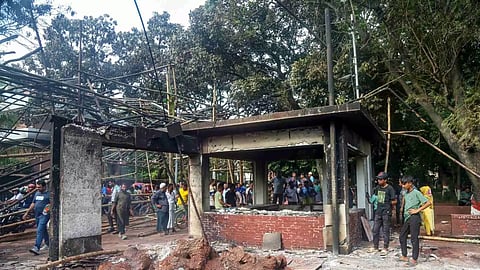 People gather in front of the house of former President Sheikh Mujibur Rahman, father of Prime Minister Sheikh Hasina