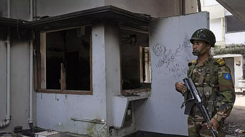 A soldier stands guard at the vandalised museum of Sheikh Mujibur Rahman (PTI)