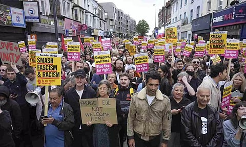 Counter protestors gather in Walthamstow, London (AP)