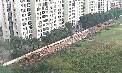 Levelling of marsh under way in Perumbakkam