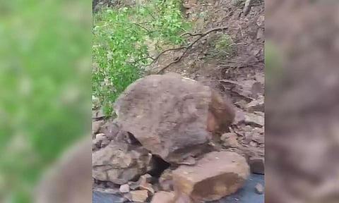  The mud slip on the ghat road being cleared. 