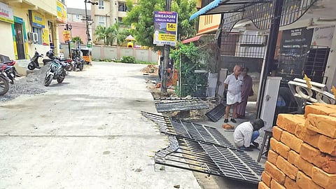 Ground level of homes sinks below road height 