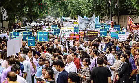 Doctors stage a protest march amid the 24-hour nationwide strike called by the Indian Medical Association (IMA) demanding justice for the woman doctor