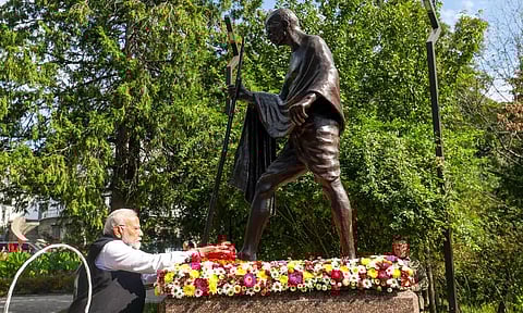 PM Narendra Modi being greeted by people upon his arrival to pay tribute to Mahatma Gandhi at his statue, in Kyiv, Ukraine (PTI)