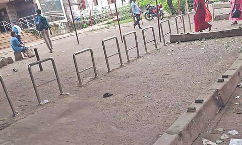 Steel barricades and concrete sleepers blocking free movement of people at the Villivakkam railway station
