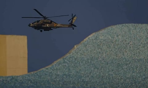 An Israeli Apache helicopter flies over Israel (AP)