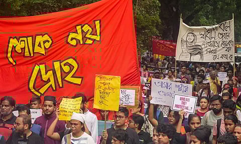 People take part in a protest march over the alleged sexual assault and murder of a postgraduate trainee doctor, in Kolkata (PTI)