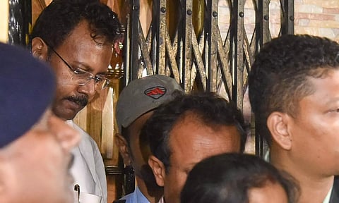 Security personnel stand guard during a raid on the premises of former medical superintendent of RG Kar Medical College Sanjay Vashisth (PTI)