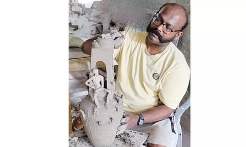 Dr C Jawahar working on his How to Seed My Land sculpture 