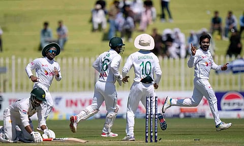 Bangladesh players celebrate the fall of a Pakistan wicket