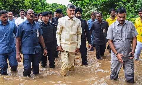 Andhra Pradesh Chief Minister N Chandrababu Naidu inspects a flood affected area (PTI)