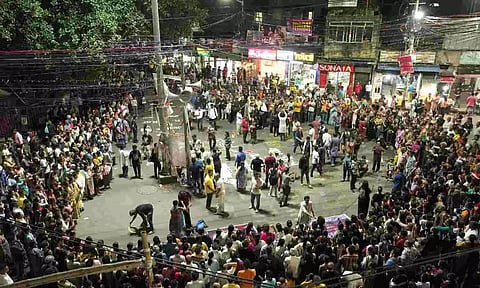 People take part in a protest over the alleged sexual assault and murder of a trainee doctor in Kolkata on Sunday (PTI)