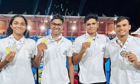 Swimmers from Tamil Nadu contingent pose with their medals
