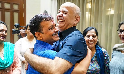 Delhi Chief Minister Arvind Kejriwal being greeted by party leader Manish Sisodia as he arrives at his residence after being released from Tihar Jail on bail, in New Delhi (PTI)