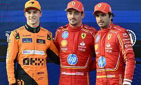Ferrari's Charles Leclerc (centre) poses with second placed McLaren's Oscar Piastri (left) and third placed Ferrari's Carlos Sainz