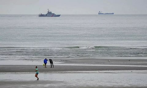 A vessel of the French Gendarmarie Nationale patrols in front of the Wimereux beach (AP)