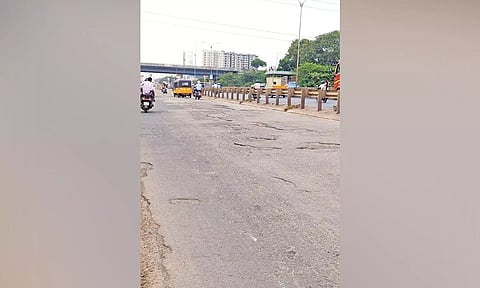 Service road leading to the Chennai-Kolkata Highway is riddled with potholes
