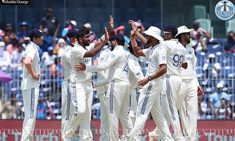 Jasprit Bumrah celebrates with teammates after taking the wicket (Justin George)
