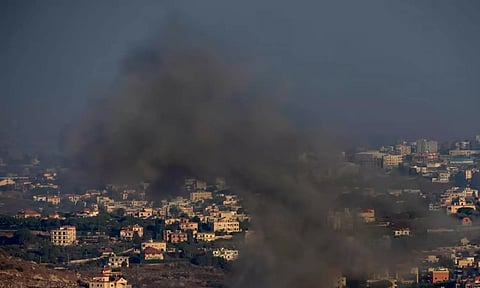 Smoke rises from an Israeli airstrike on Kfar Rouman village, as seen from Marjayoun town, south Lebanon (AP)