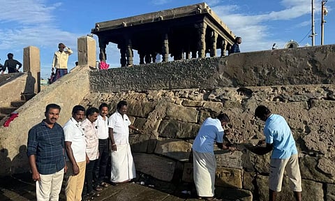 Officials inspecting renovation work of the damaged steps at the Triveni Sangamam in Kanniyakumari. Photo: Daily Thanthi.