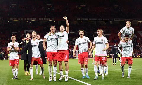 FC Twente players celebrate after their match against Manchester United