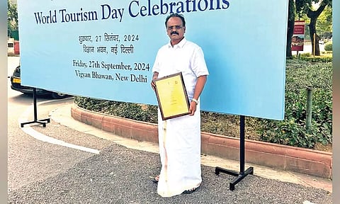 E Venkata Subramanian, president, Keeladi panchayat, with the award