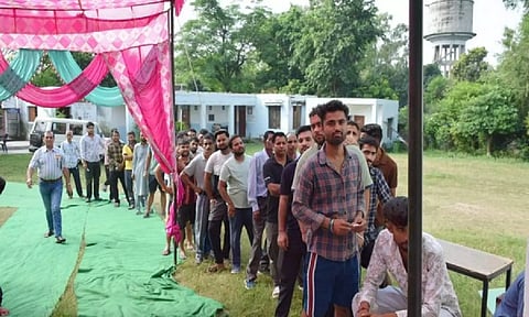Long queues at a polling booth in Jammu