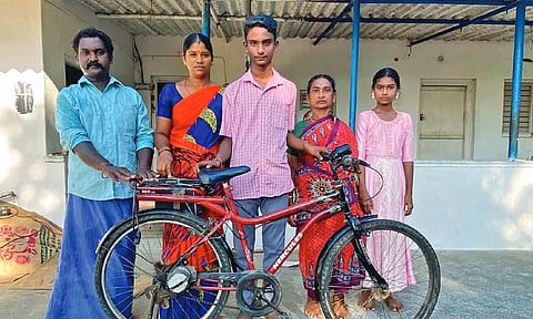 Abhishek with his e-bicycle and family