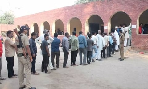 Voters standing in queue to cast their votes(IANS)