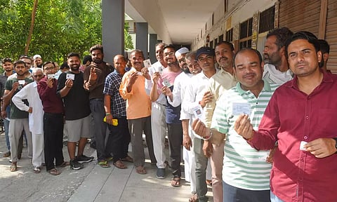 Voters at a polling station in Haryana